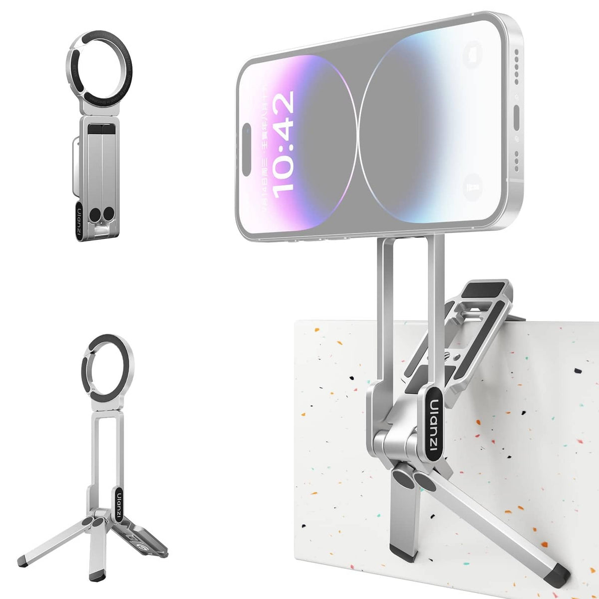 Portable magnetic phone tripod in lunar silver, holding a smartphone on a tabletop stand