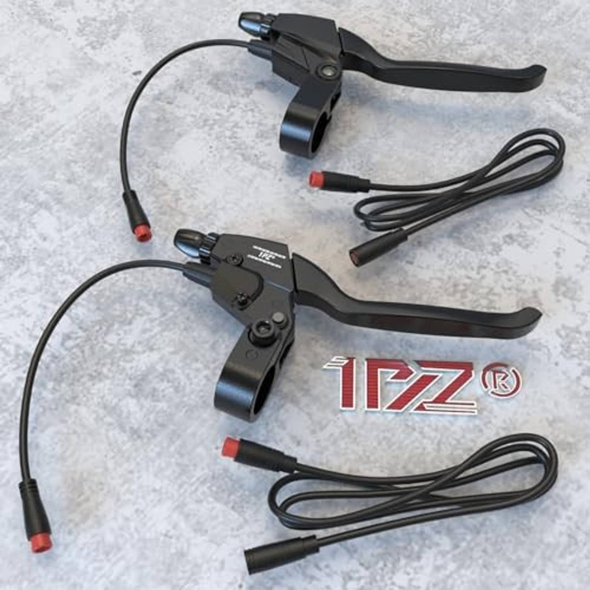 Two waterproof e-brake levers with coiled black cables and red connector ends