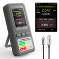 Grey radon detector with LCD showing 2.647 pCi/L and testing details