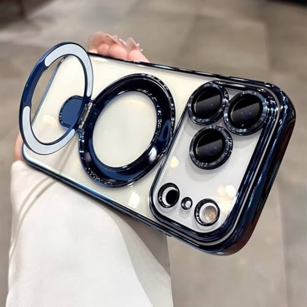 Clear and blue magnetic phone case with ring holder and four camera openings