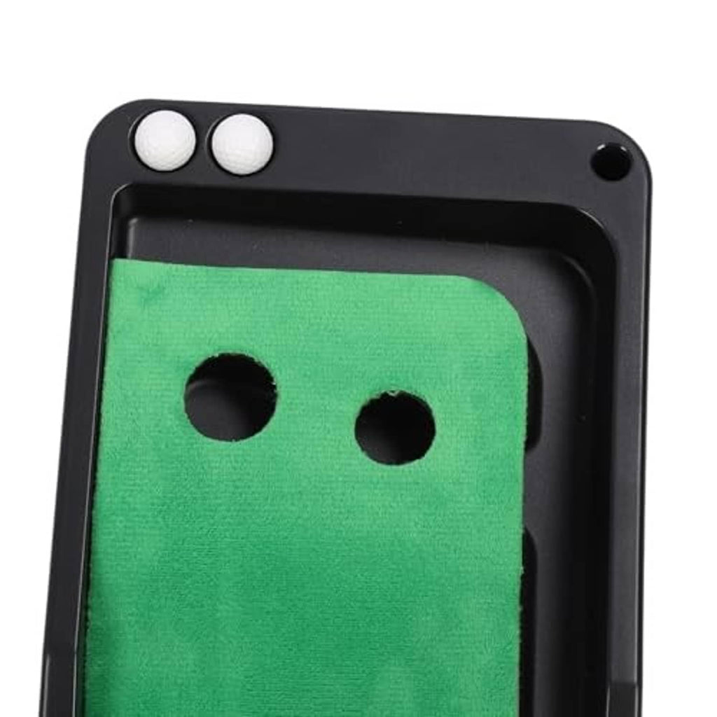 Automatic return putting mat close-up of green surface with two ball holes