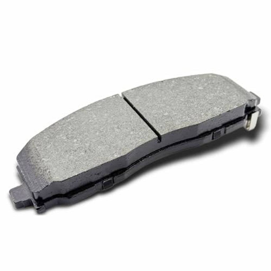Ceramic brake pad with gray friction surface and black metal backing, angled side view