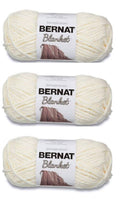 White Bernat Blanket super bulky yarn skeins, three-pack on display
