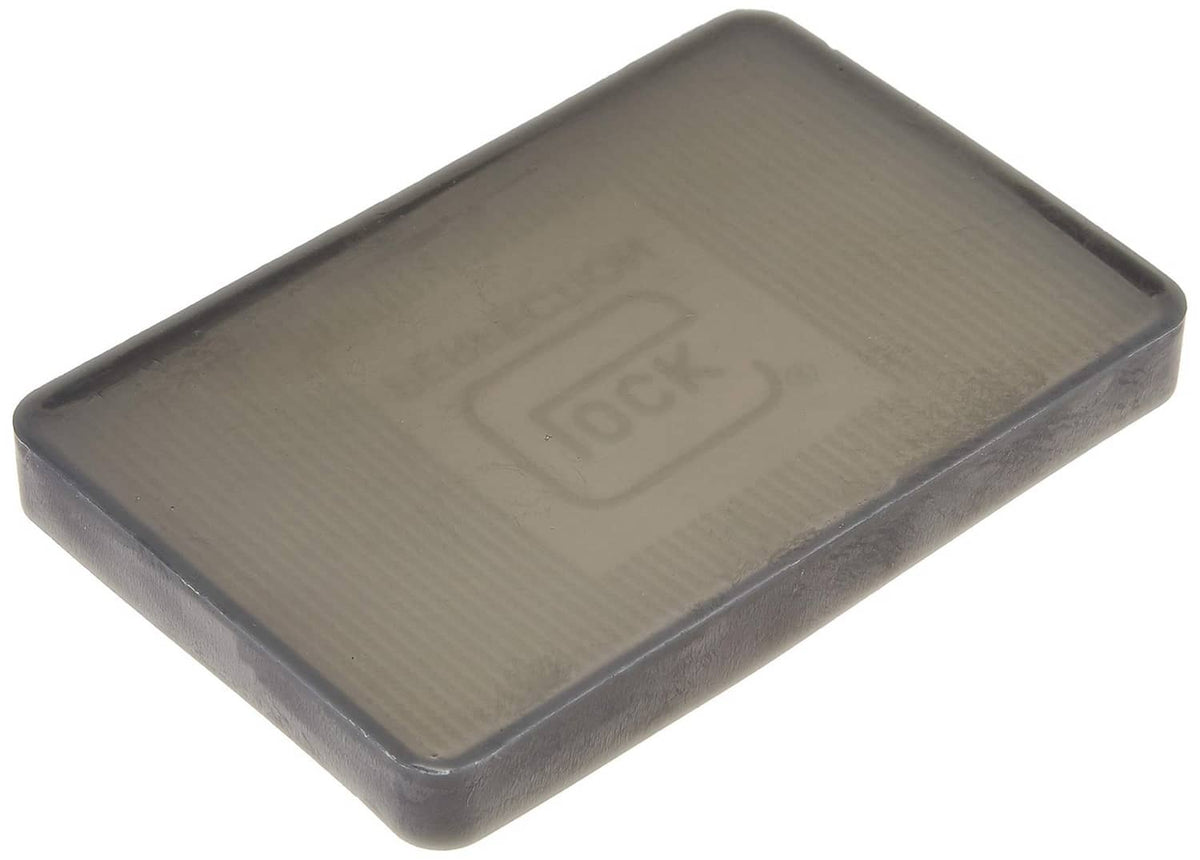 Glock OEM parts tray, translucent dark-gray lid with centered “LOCK PERFECTION” emblem.