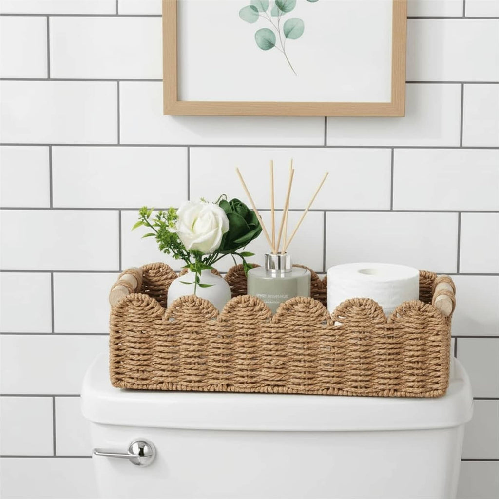 Scalloped woven rattan toilet paper basket with tissue roll and decor stems