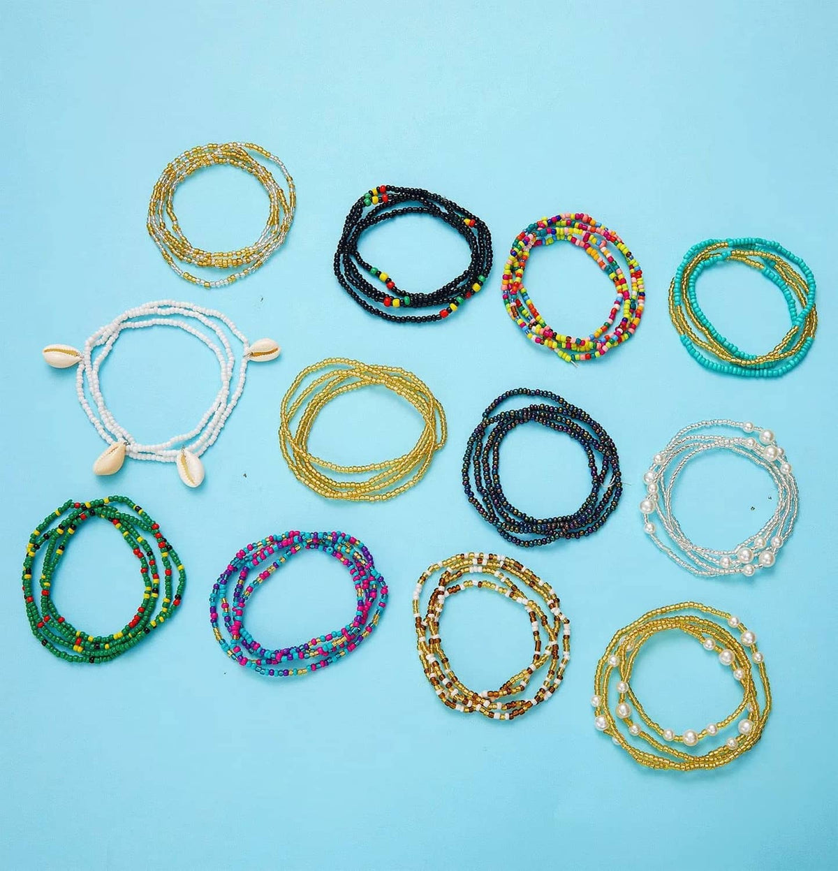 Assorted beaded waist chains, 12 styles in gold, black, white, and multicolor beads