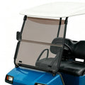 Tinted folding golf cart windscreen with dark mounting brackets and clear frame