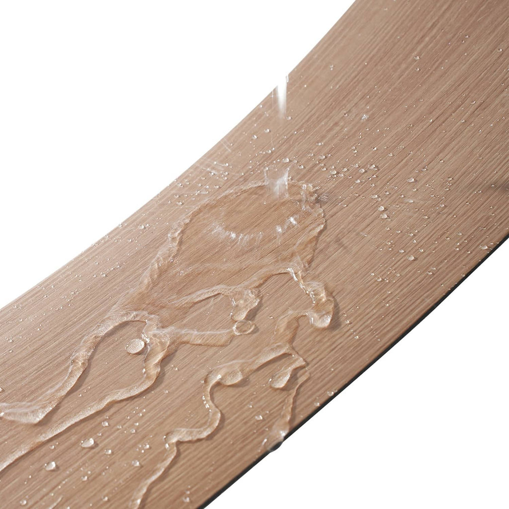 Wood-grain PVC floor tile close-up with embossed pattern and adhesive dots