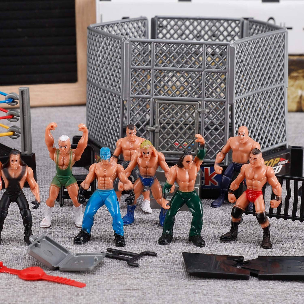 Mini wrestling arena with gray fence panels and multiple wrestler action figures