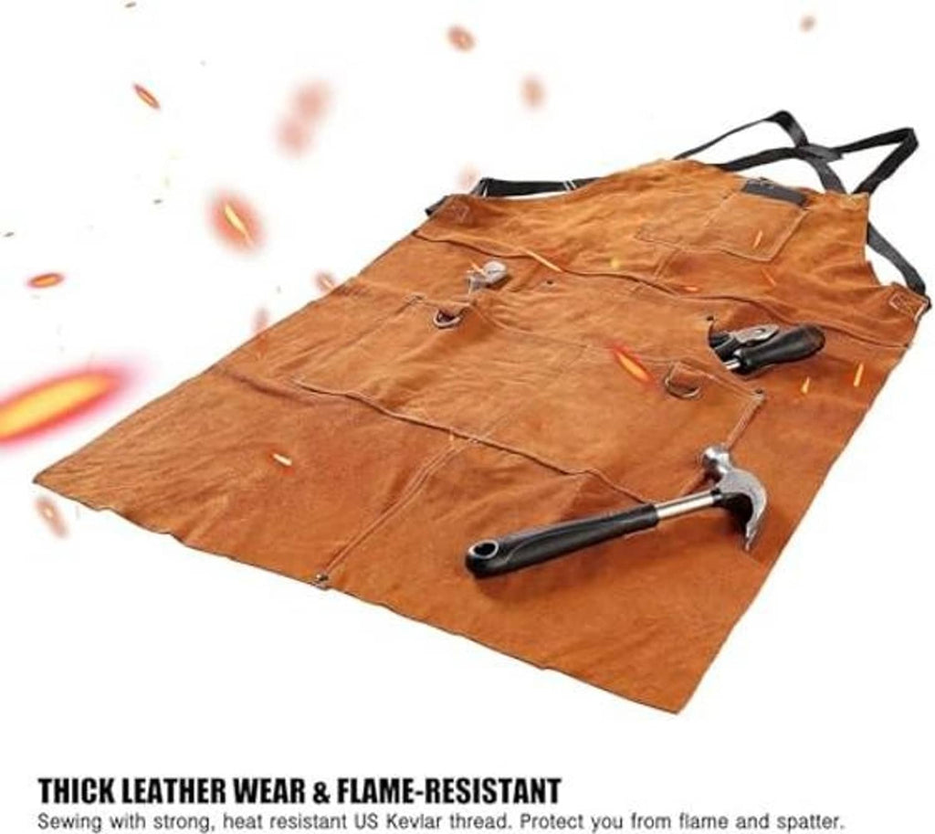 Brown leather welding apron laid flat with tools and hanging strap ties