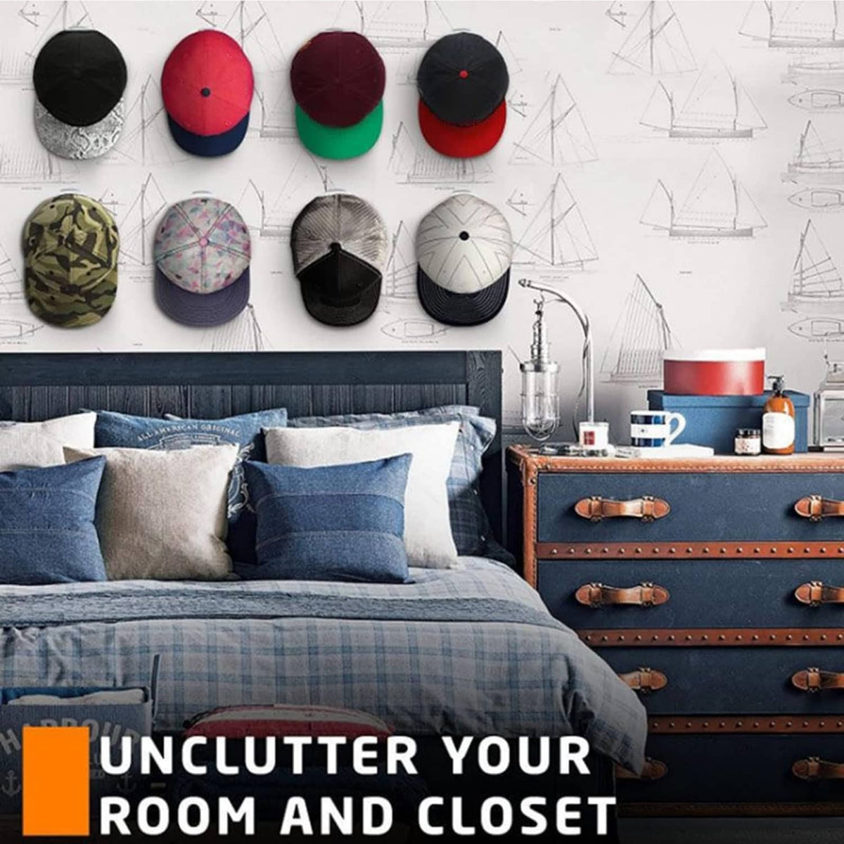 Baseball caps displayed on black adhesive hat hooks above a bed