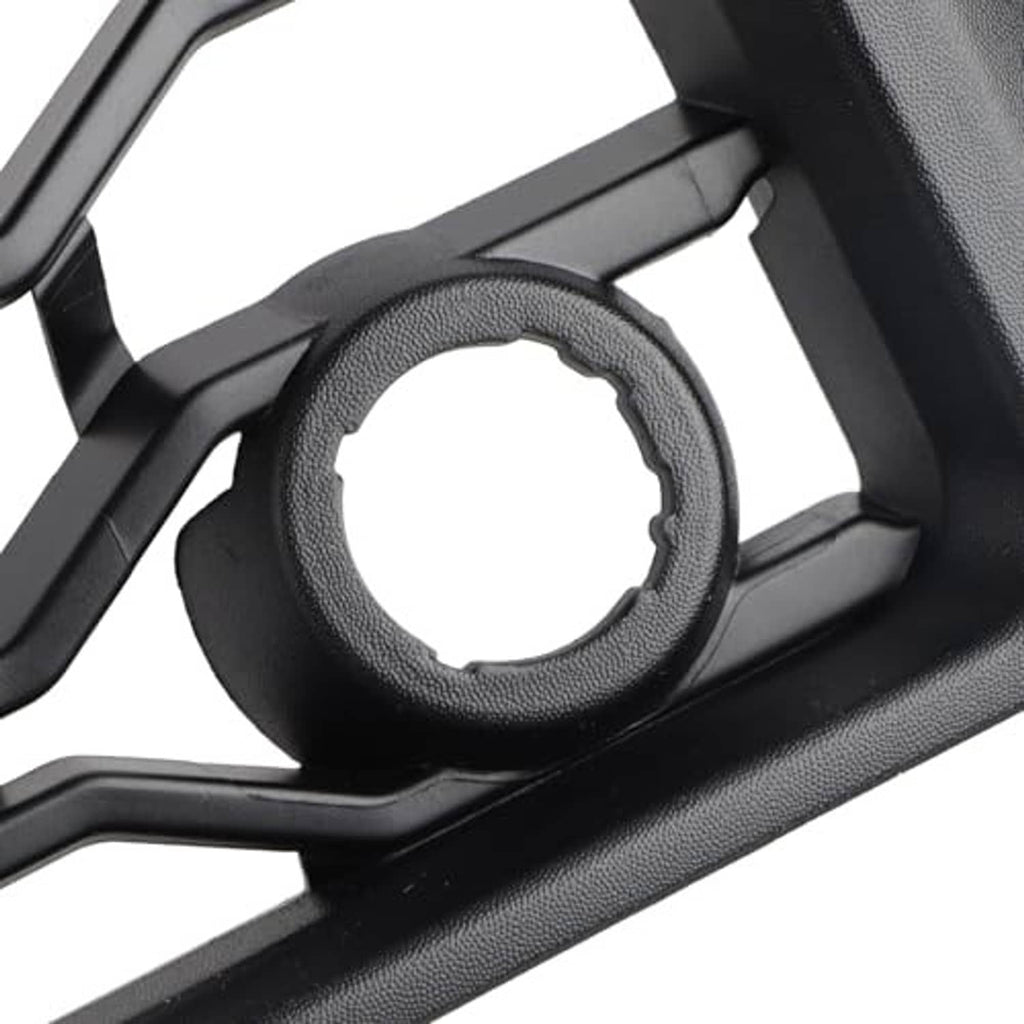 Black grille detail showing circular opening with textured trim ring