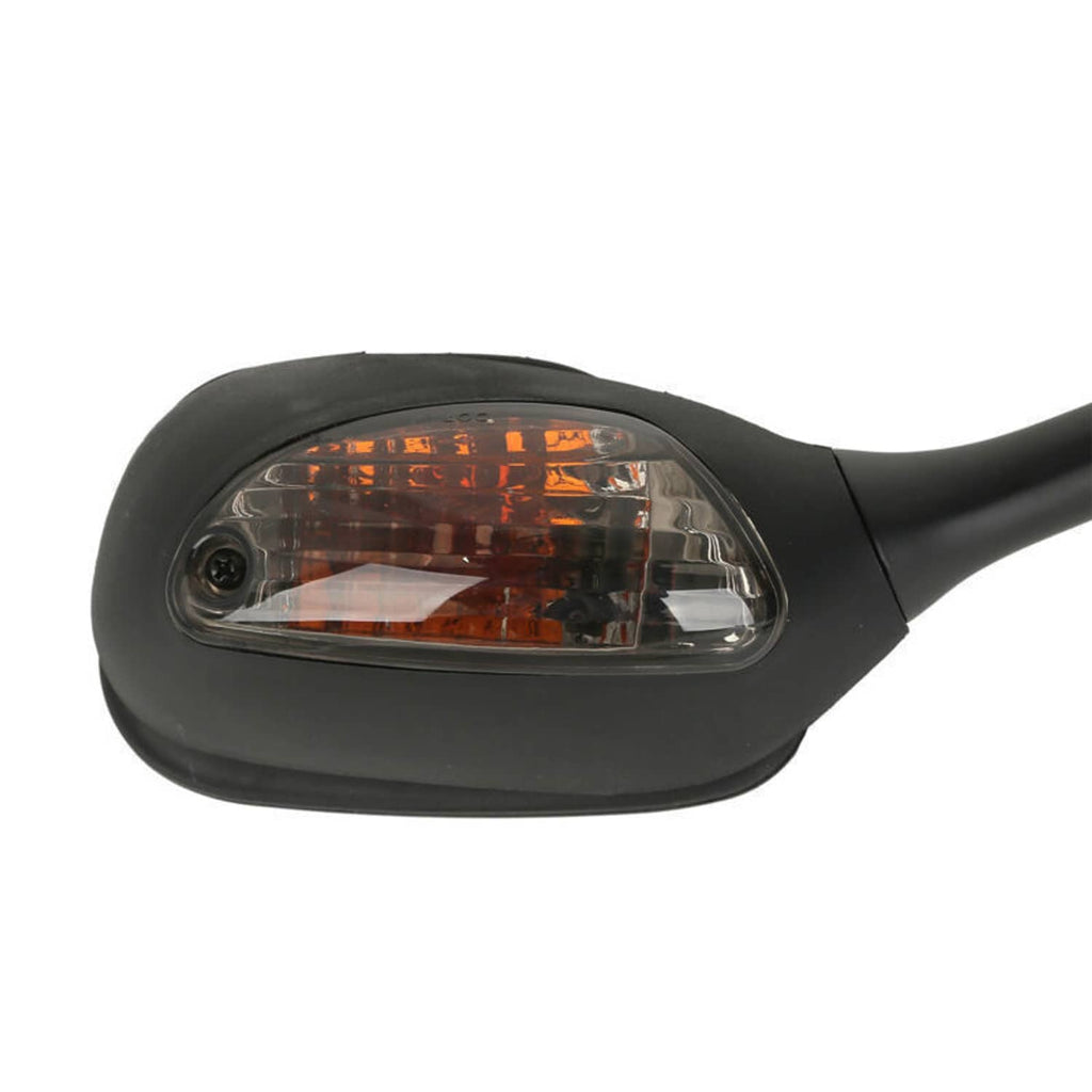 Close-up view of amber turn signal lens within a black motorcycle rearview mirror housing