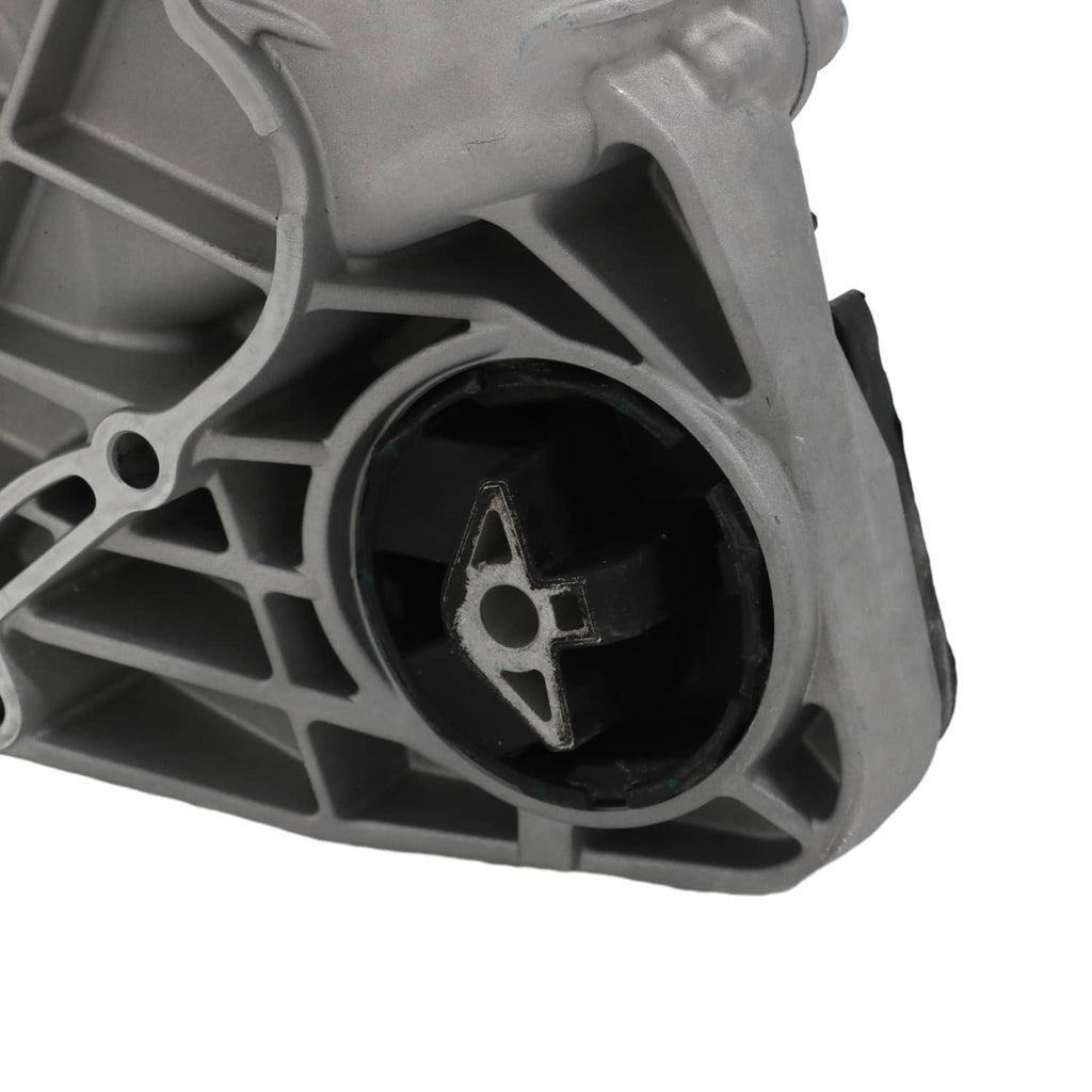 Transfer case assembly close-up of black mount bushing inside gray ribbed casing