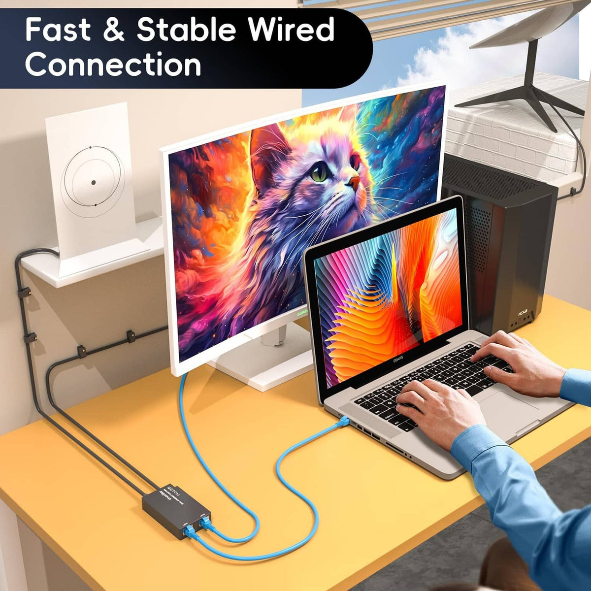 Gray dual-port Ethernet adapter with Ethernet cable connected to a laptop
