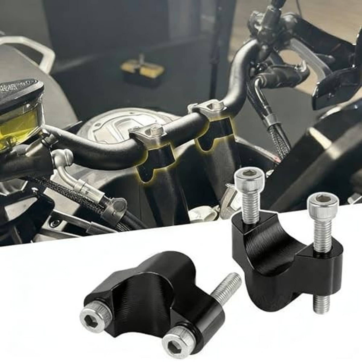 Pair of black handlebar riser clamps with silver mounting bolts, angled view