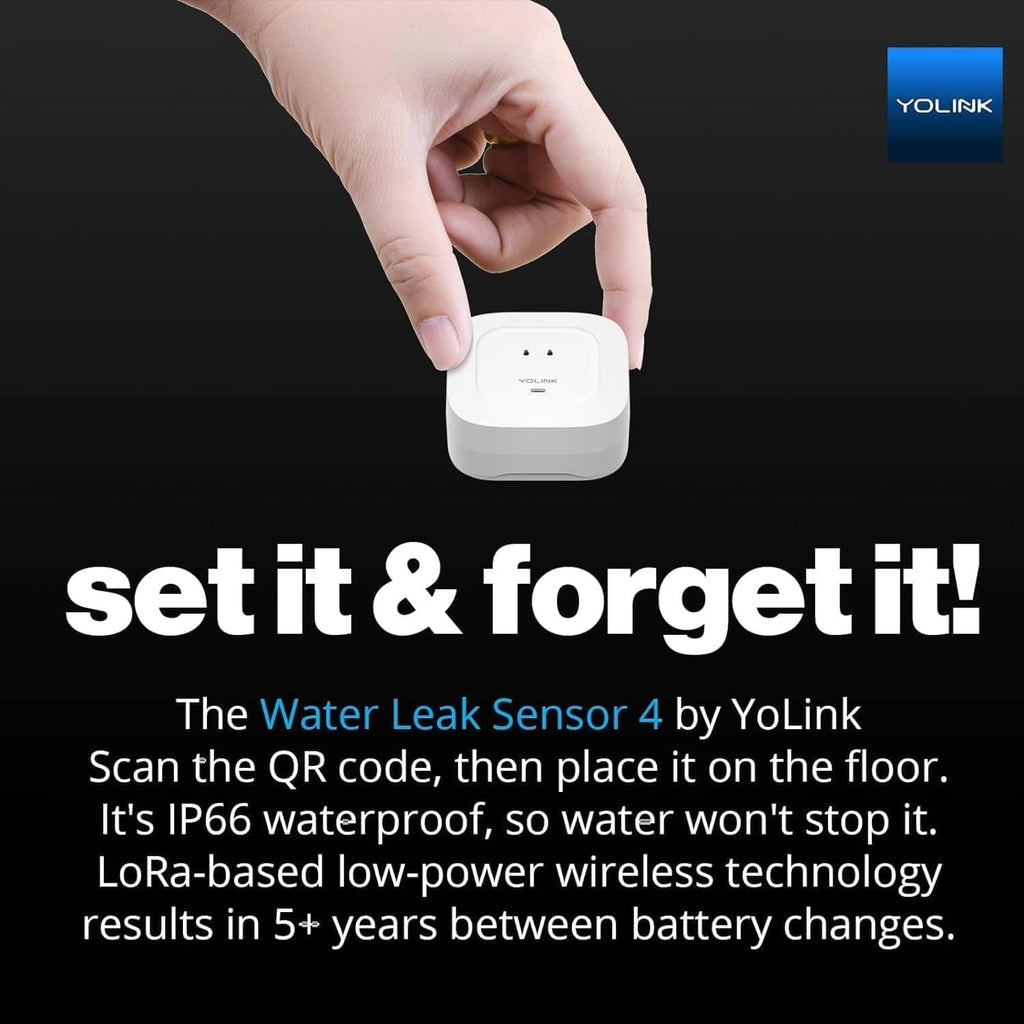 White YOLINK Water Leak Sensor 4 in hand, ready to scan and place on floor