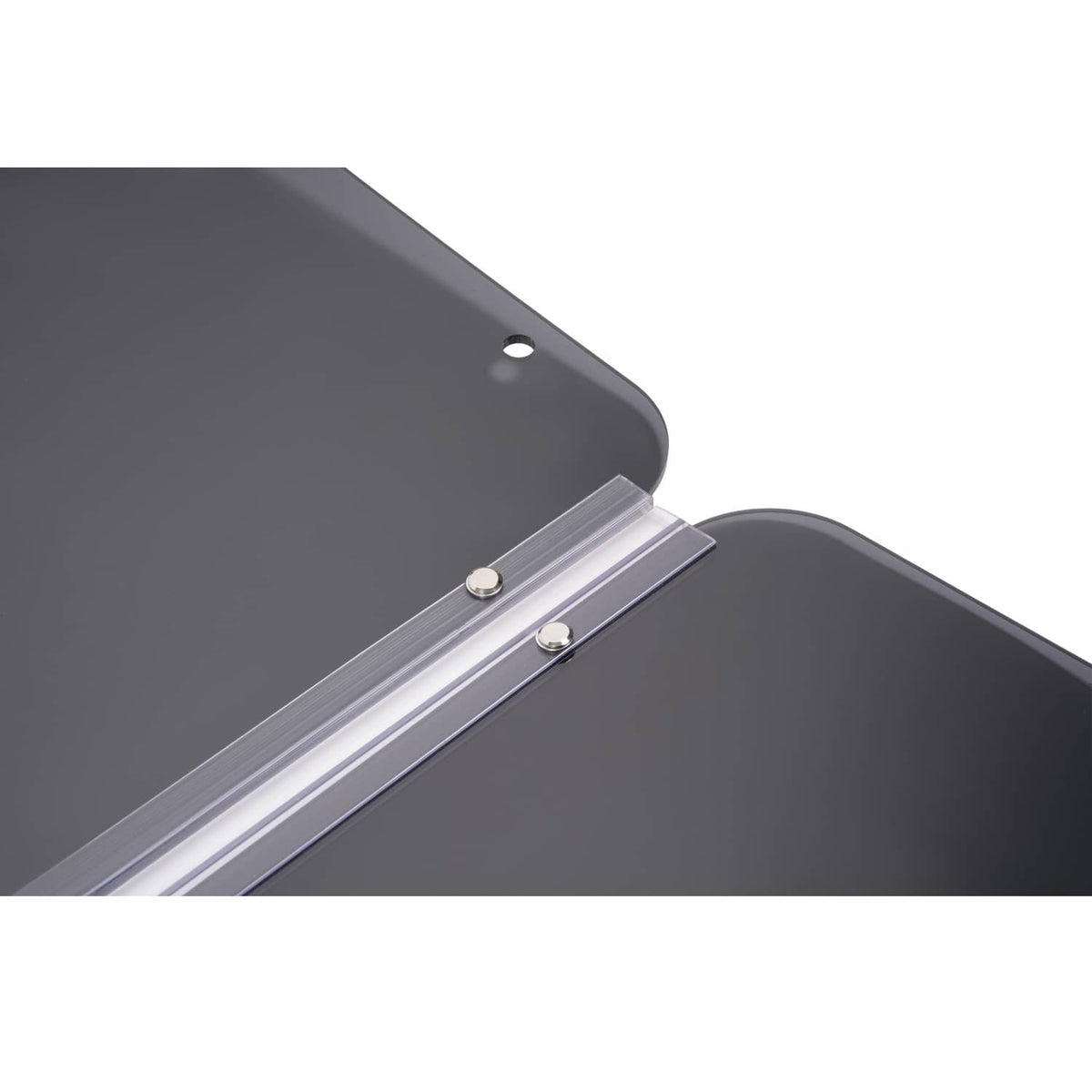 Close-up of tinted windshield panel with metal hinge bar and rounded edge