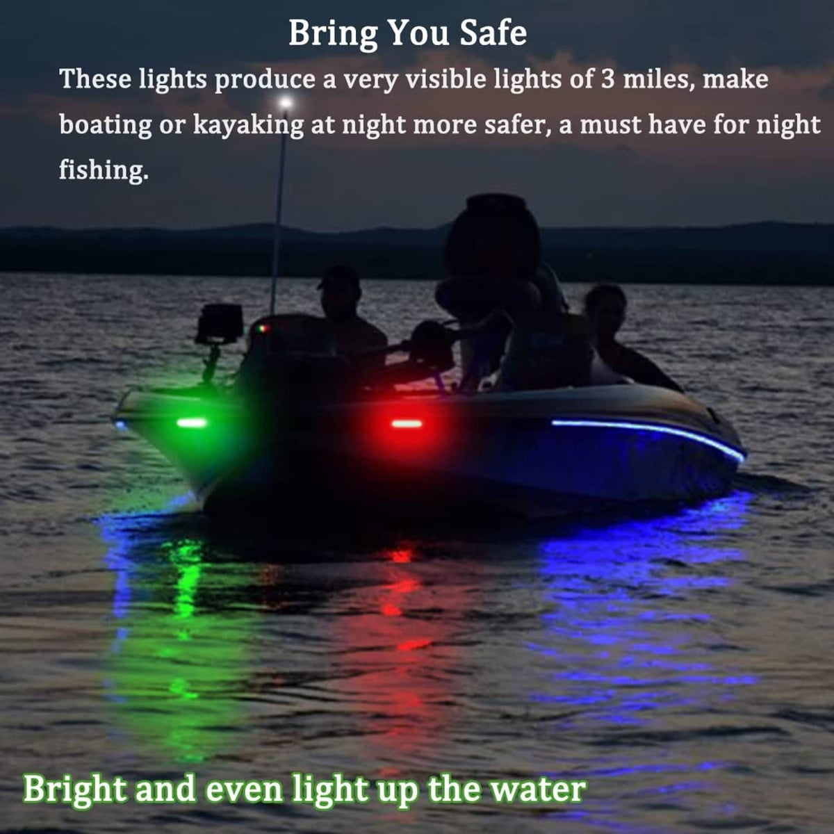 Boat bow navigation lights shining green and red on dark water at night