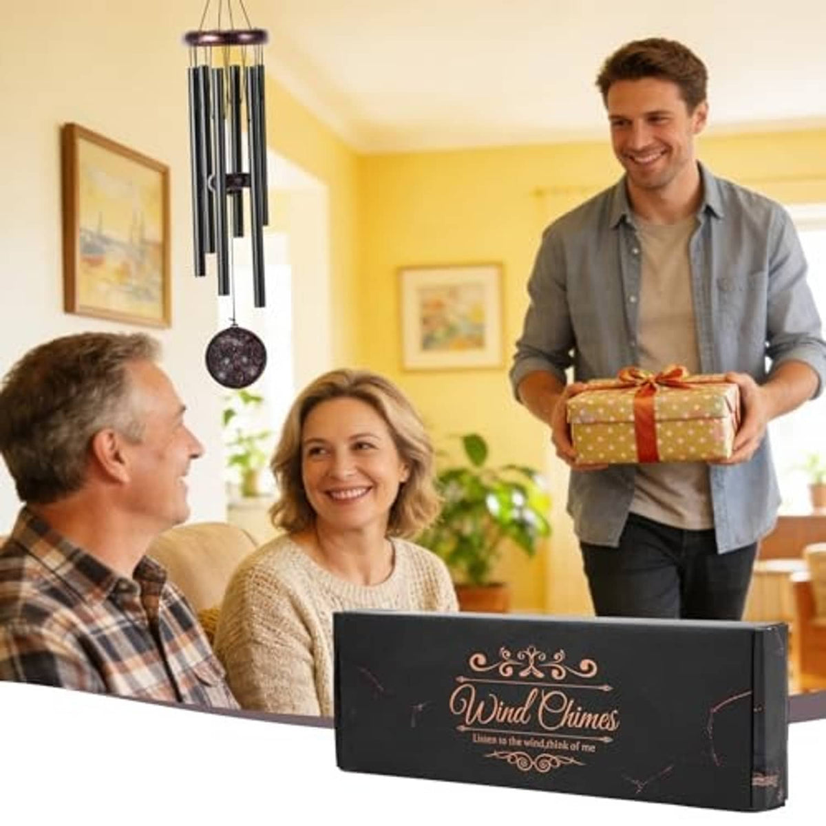 Wind chime beside gift box, featuring copper butterfly medallion and six black tubes