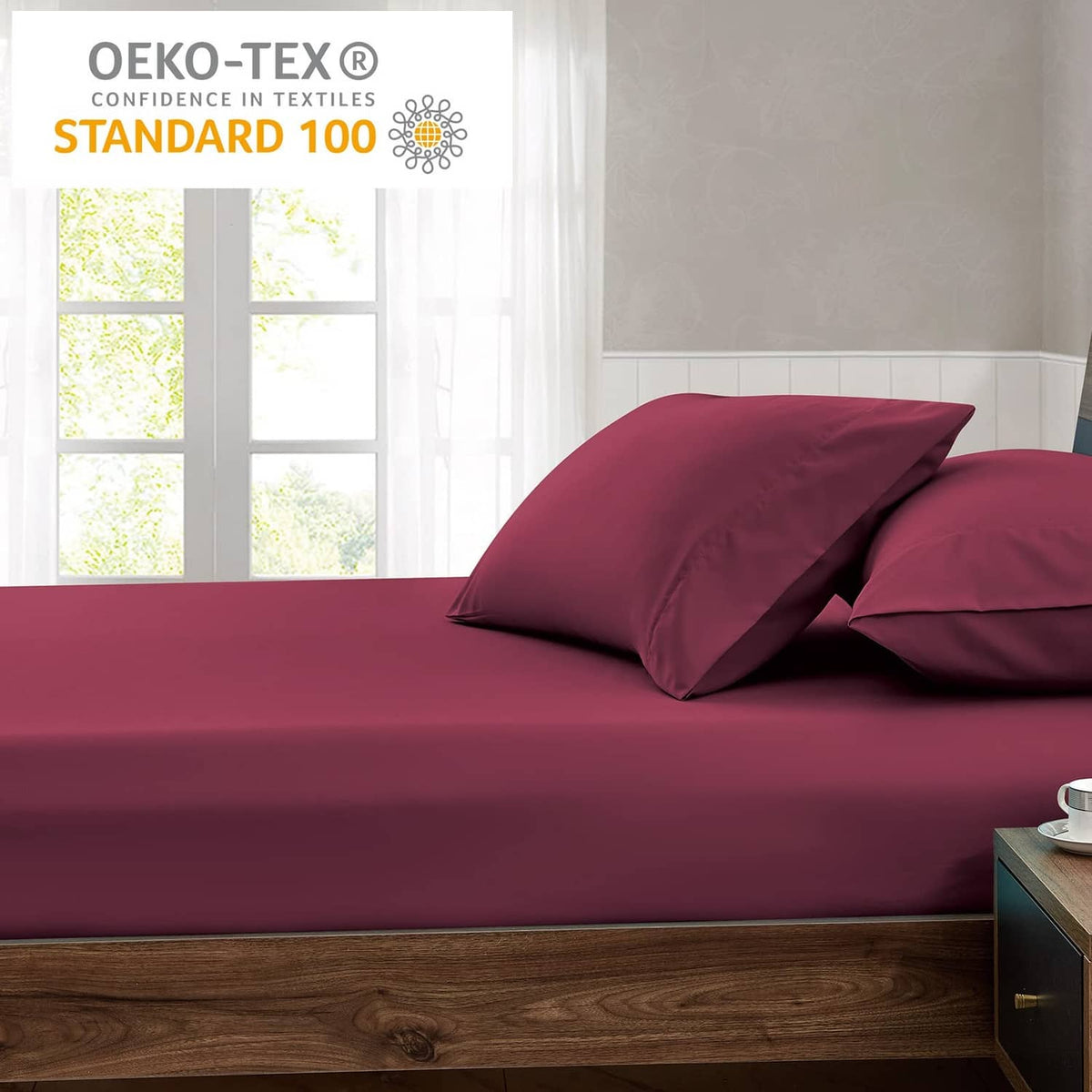 Burgundy queen fitted sheet on bed with matching pillows