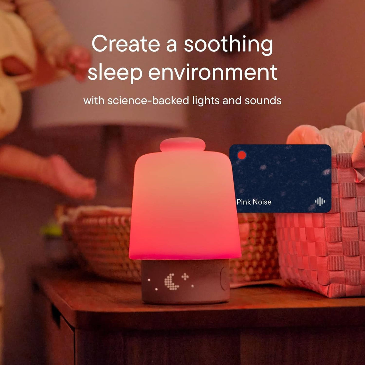 Baby sleep sound machine night light with pink glow on the rounded top base