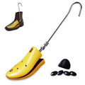 Adjustable yellow boot stretcher with metal handle and small black bunion plugs