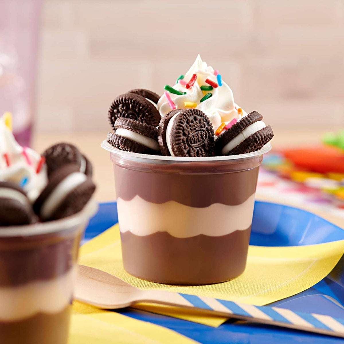 Mini dessert cup topped with Oreo minis sandwich cookies and cream