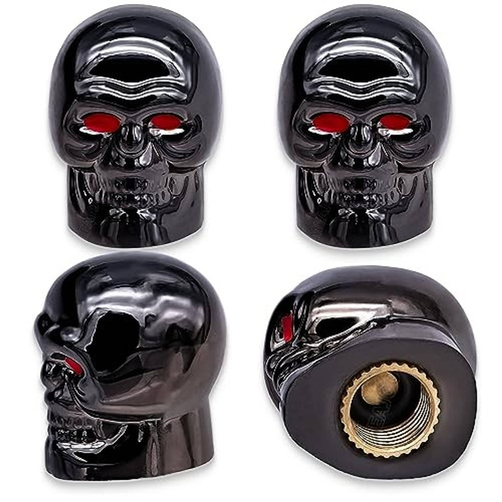 4-piece skull tire valve stem caps, glossy black with red eyes and gold-toned threads