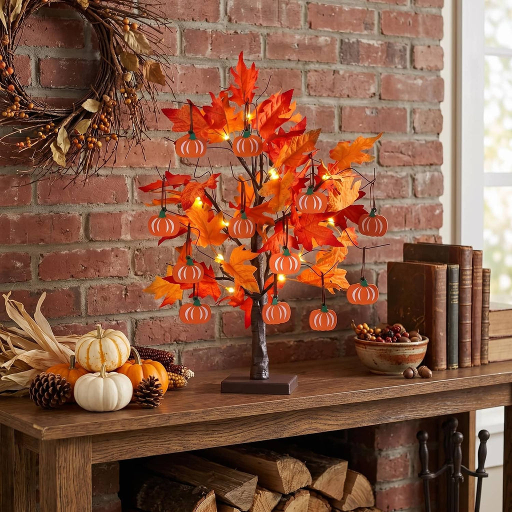 Decorative fall tree with orange maple leaves, warm LED lights, and hanging pumpkin ornaments