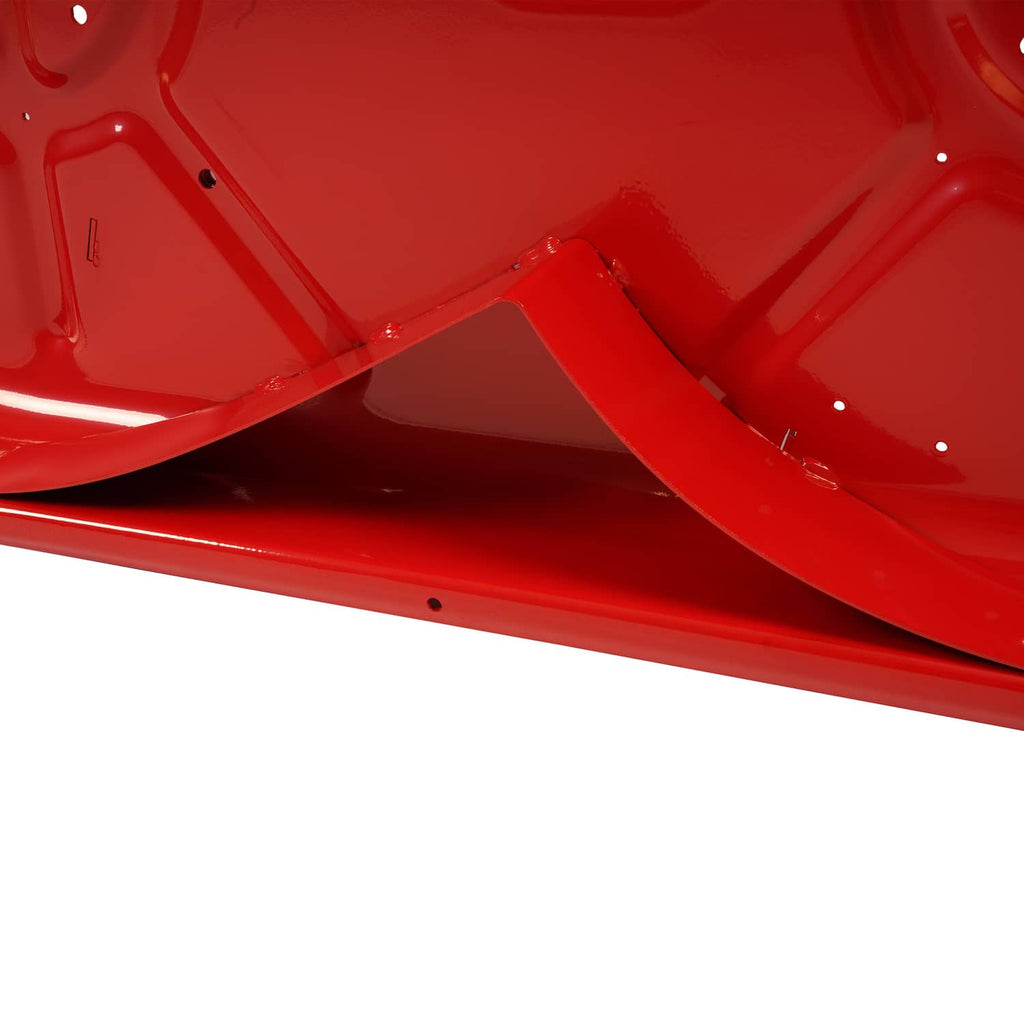 Close-up of red mower deck housing side panel with curved ribbed channel