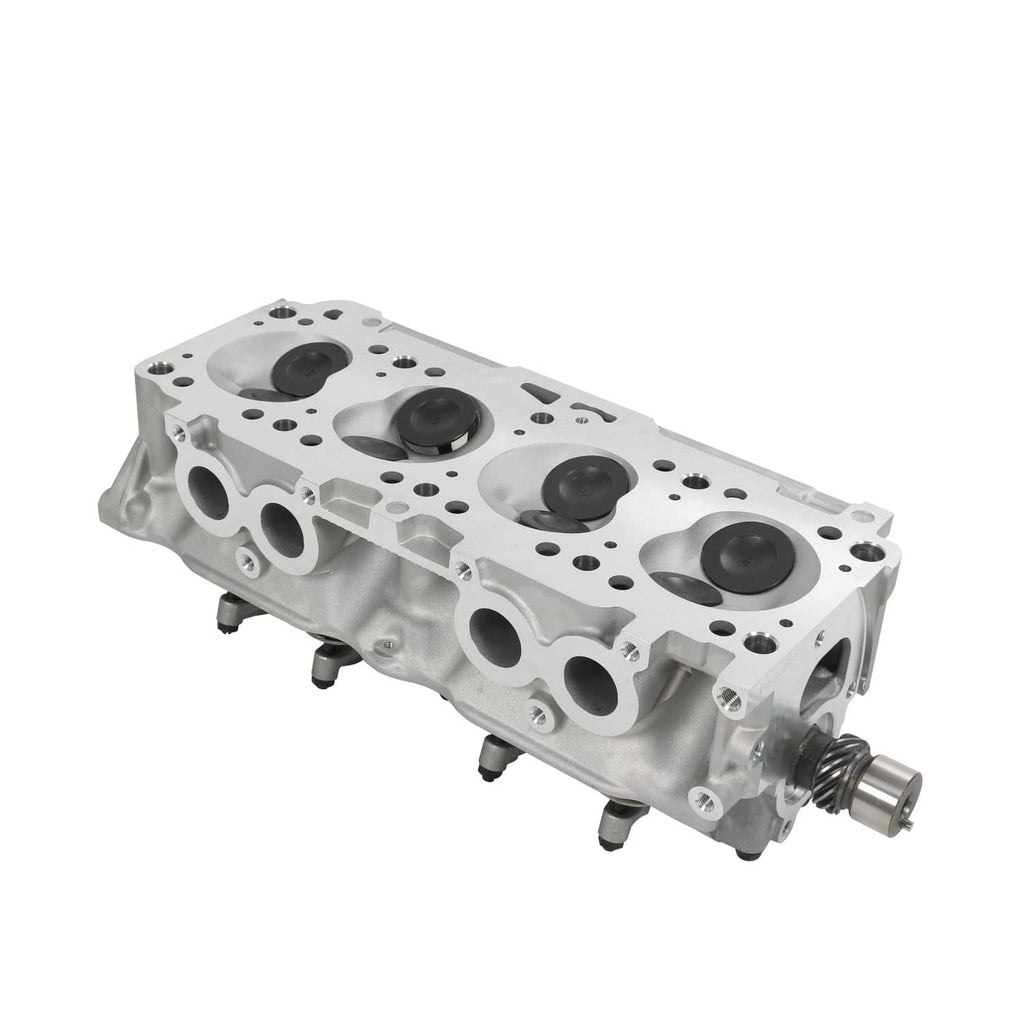 Cylinder head with machined gasket surface and valve chamber openings, metallic silver