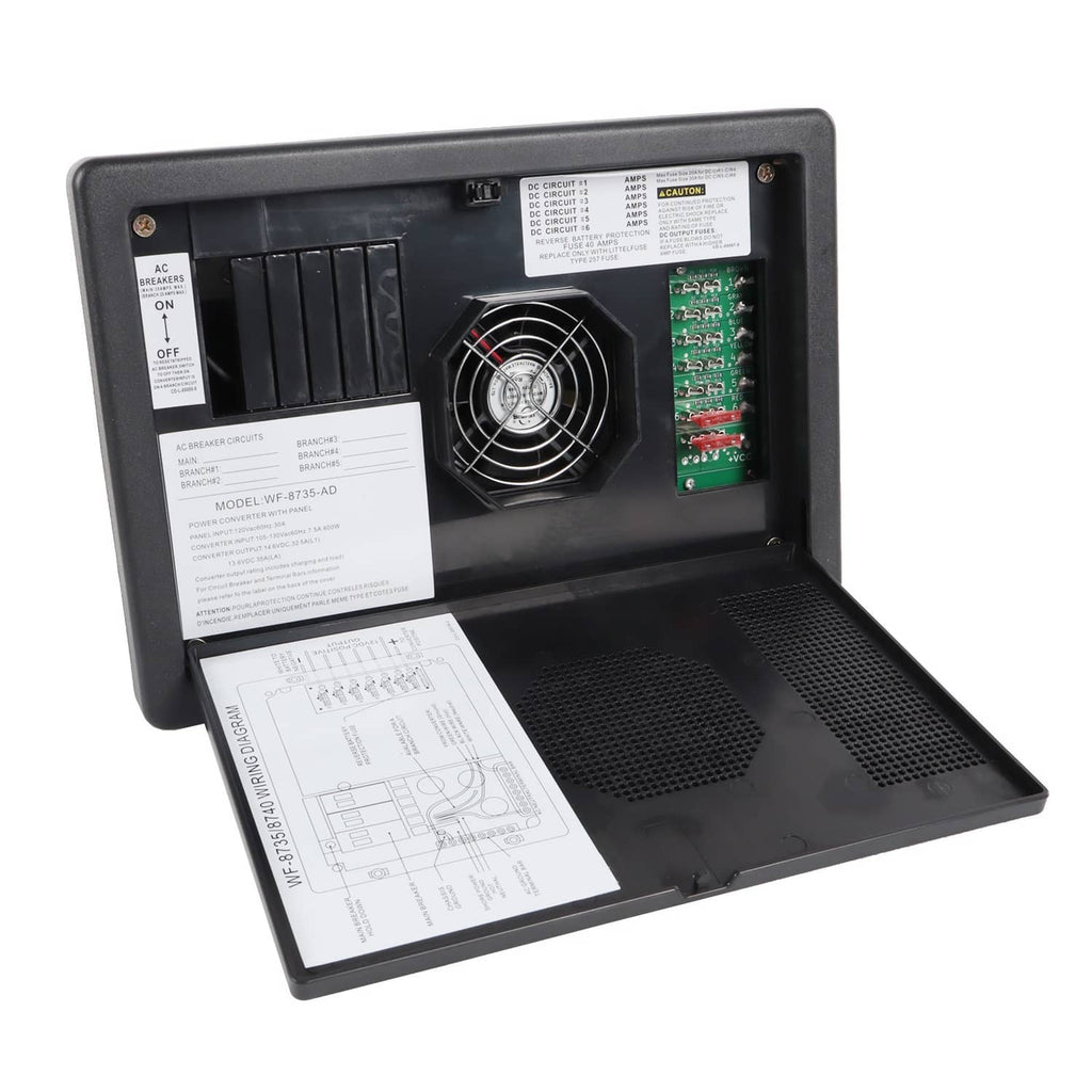 RV power converter battery charger open view with cooling fan, papers, and PCB board