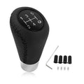 Black leather 5-speed gear shift knob with numbered shift pattern and silver base sleeve