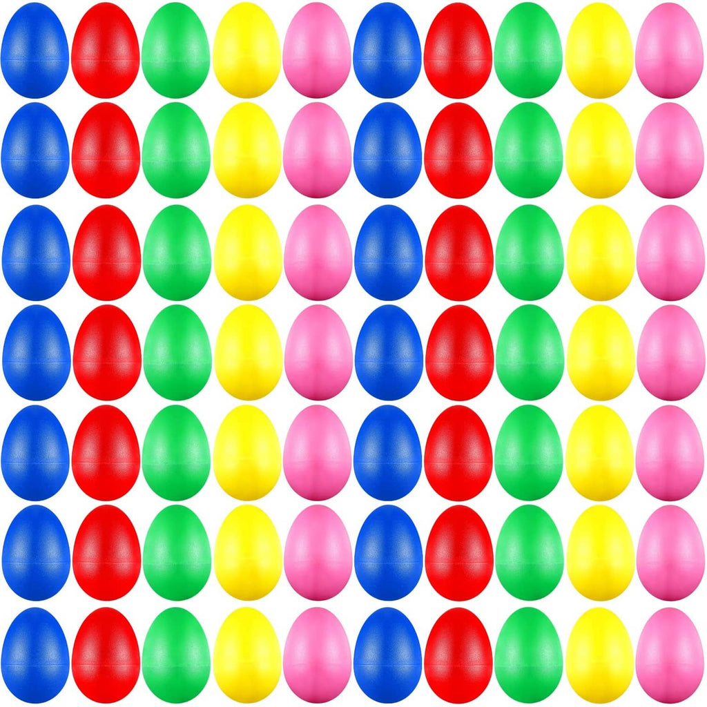 Colorful plastic egg shakers in rows, red blue green yellow pink eggs