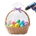 Clear PVC shrink wrap bag over basket with colorful Easter eggs, tied purple ribbon
