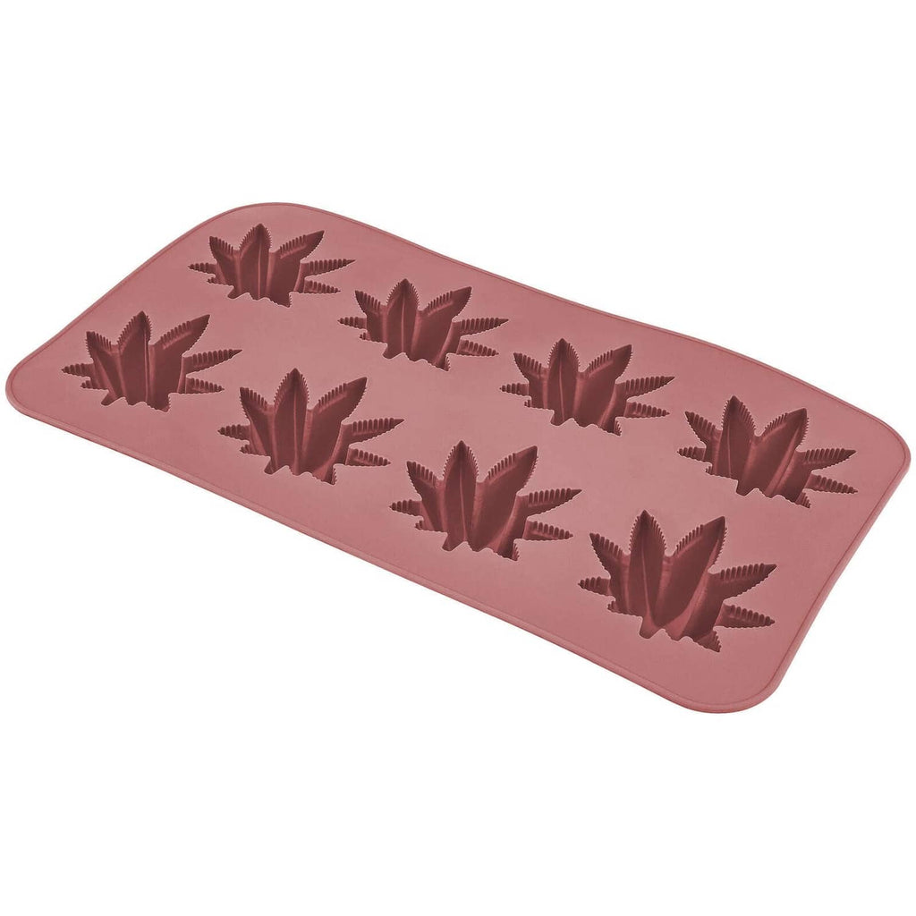 Silicone candy mold tray with raised Japanese maple leaf shapes, pink