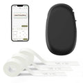 Portable black Bluetooth label maker with oval body and white label tape rolls