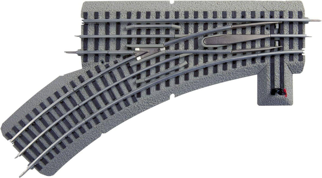 Fastrack manual left-hand track switch with visible turnout mechanism on ties