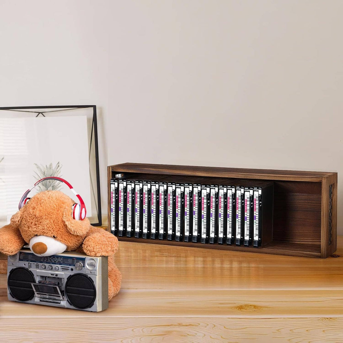 Wooden cassette tape storage bench with open front and rows of cassette tapes inside