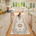 Washable runner rug with beige, blue, and orange vintage-style medallion pattern