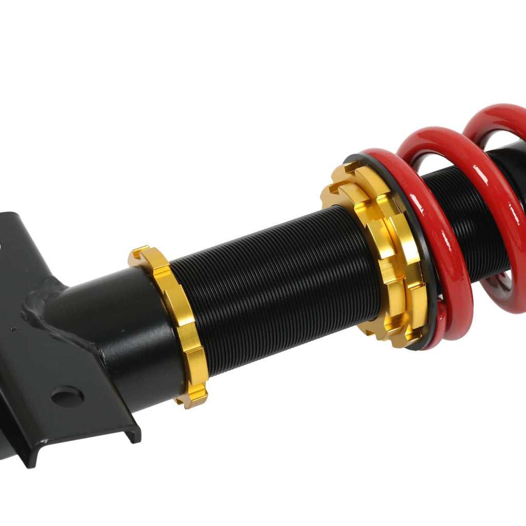 Front coilover strut absorber with red coil spring and gold adjustment collar