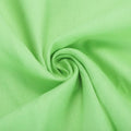 Grass green knit fabric, close-up of folded texture
