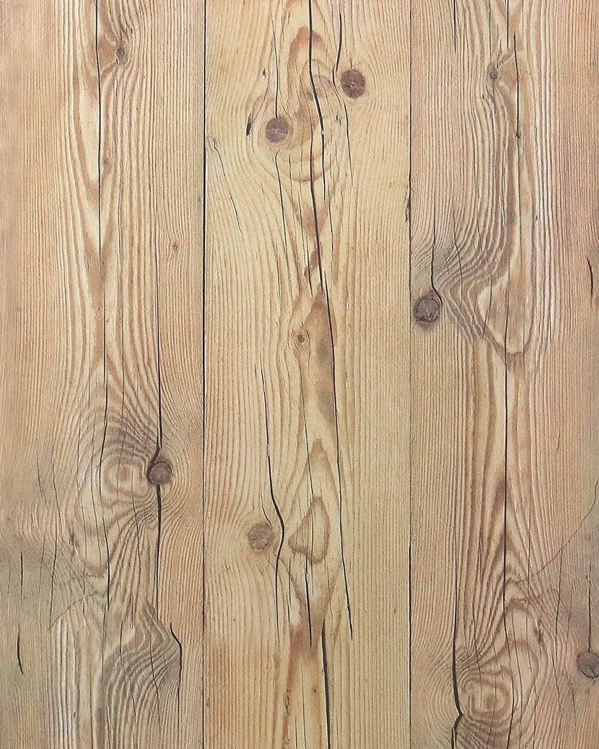 Close-up wood plank wallpaper with pale tan boards and dark knot patterns