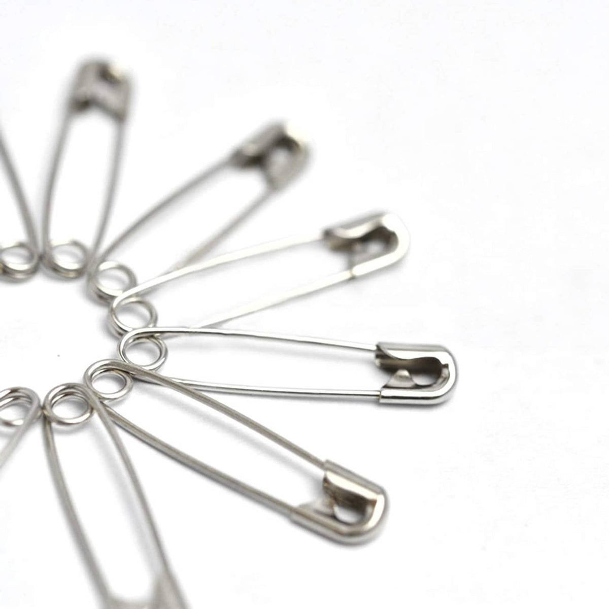 Assorted silver-tone safety pins with metal clasp heads