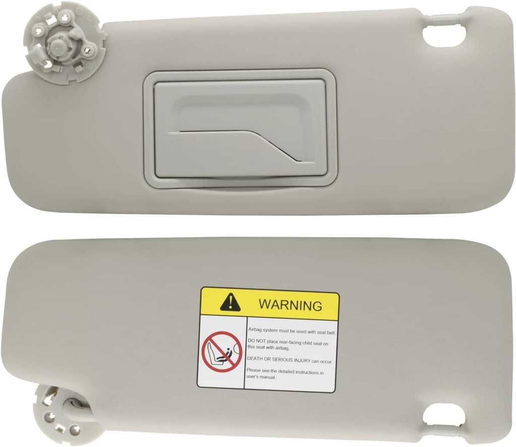 Gray left sun visor with mirror, underside view showing warning label and bracket