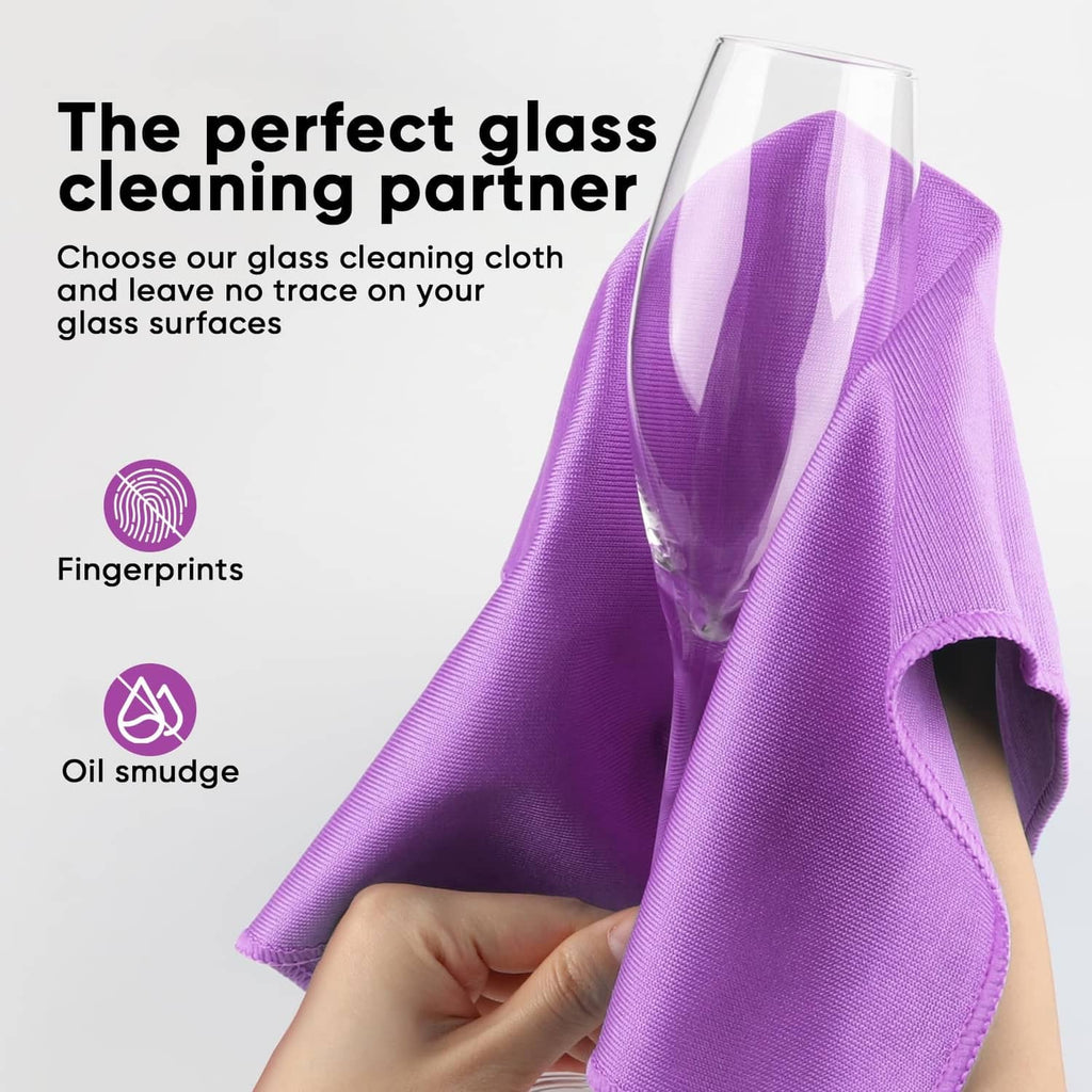 Purple microfiber glass cloth, folded, with a clear drinking glass over it