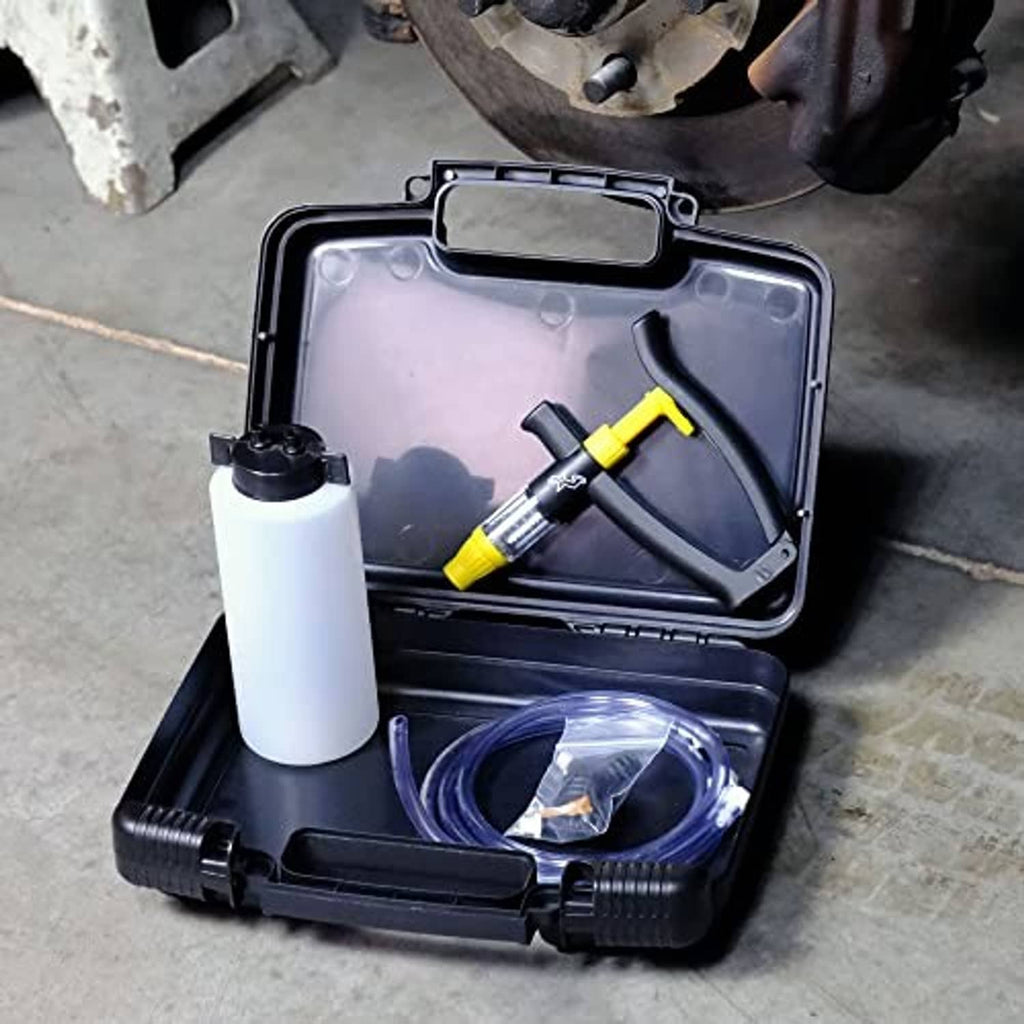 Open brake bleeder case with white bottle, yellow pump, and coiled clear tubing