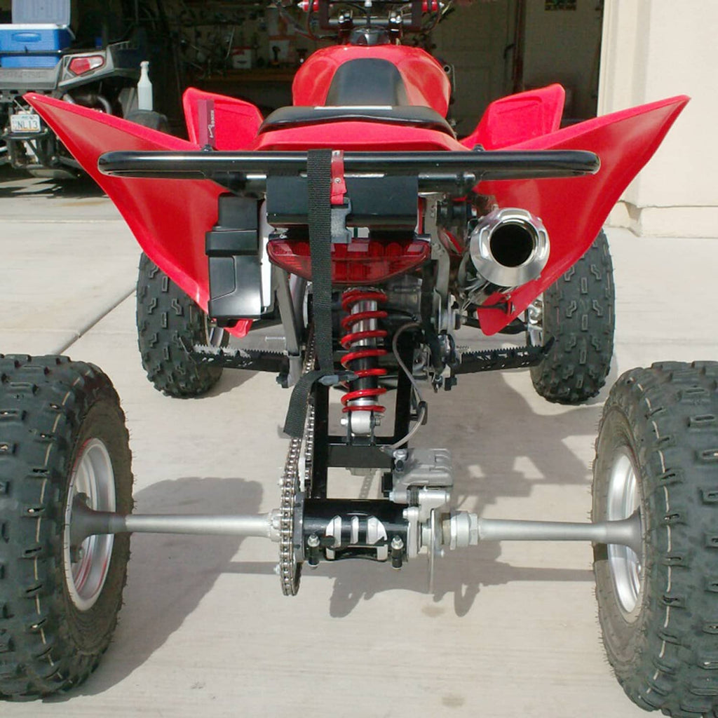 ATV air shock absorber set with black/red shocks and mounting bracket on quad