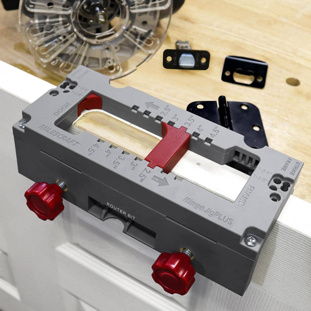 Door hinge mortising jig set on a door edge with mounting bracket and red clamp